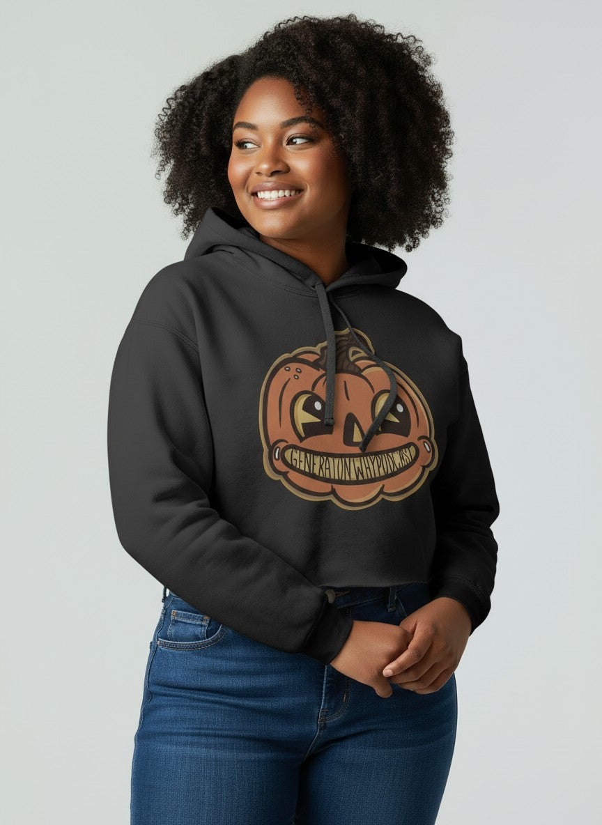 A woman wearing the black cropped hoodie with the jack o lantern design